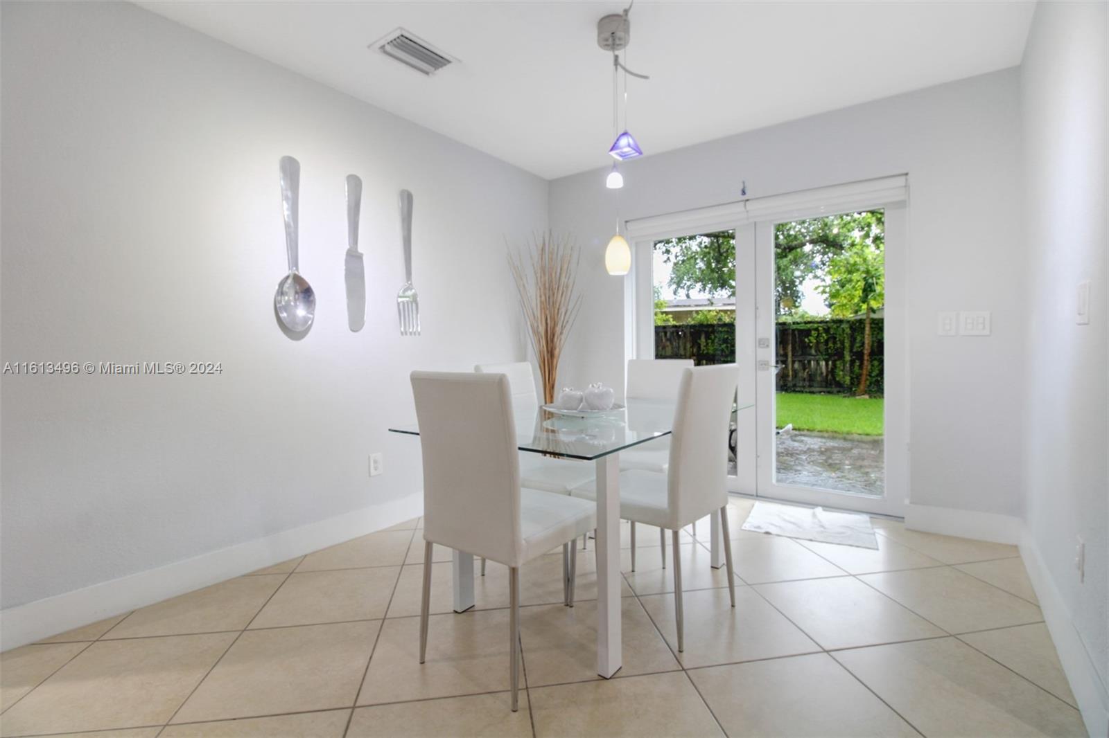 9730 Southwest 76th Street Miami, FL 33173 - Photo 6 of 27 a view of a dining room with furniture window and outside view