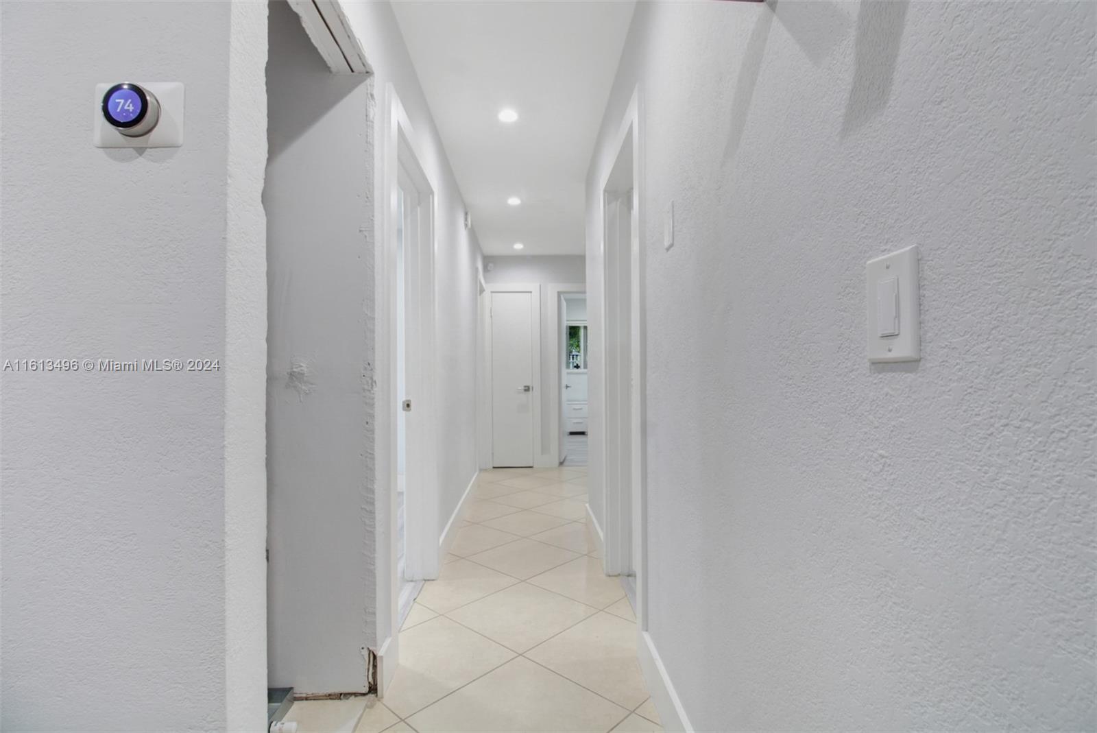 9730 Southwest 76th Street Miami, FL 33173 - Photo 7 of 27 a view of a hallway with wooden floor