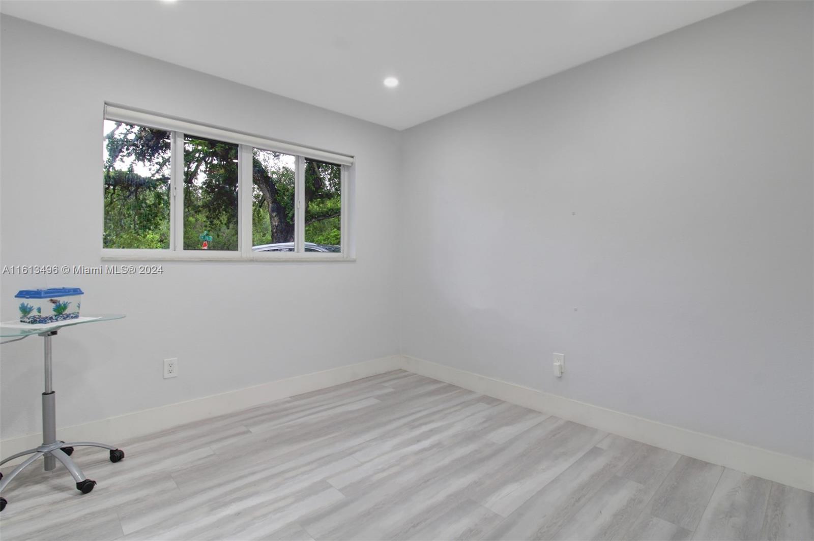 9730 Southwest 76th Street Miami, FL 33173 - Photo 8 of 27 a view of an empty room with a window