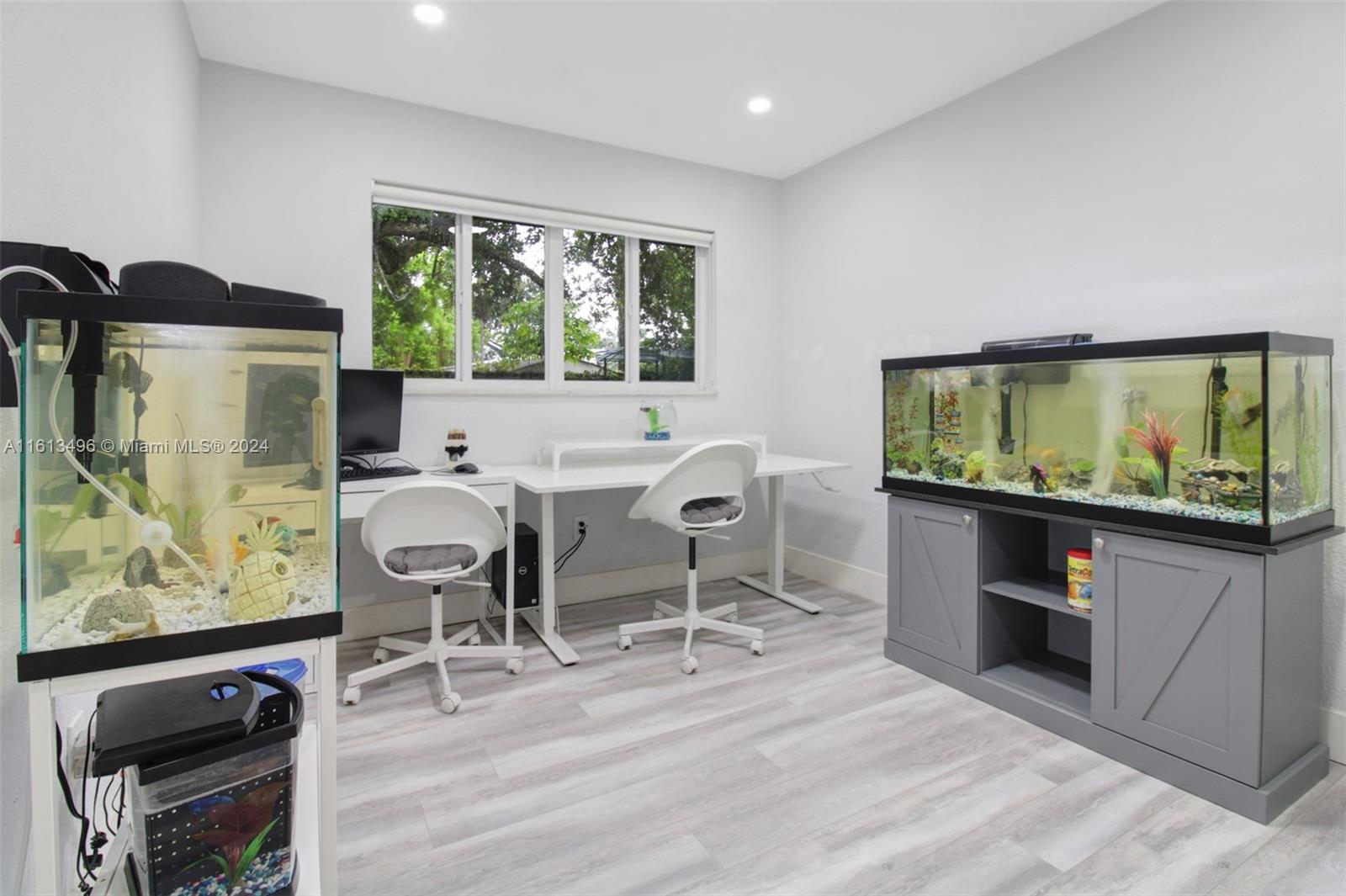 9730 Southwest 76th Street Miami, FL 33173 - Photo 9 of 27 a dining room with furniture and window