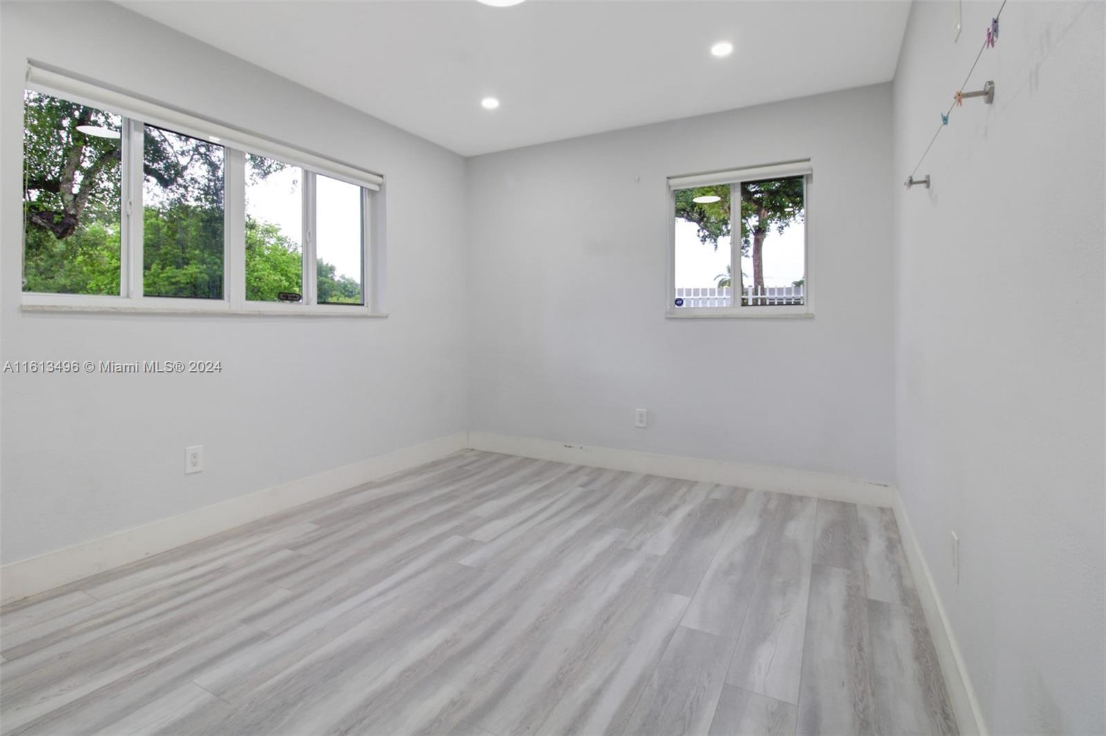 9730 Southwest 76th Street Miami, FL 33173 - Photo 10 of 27 an empty room with a window