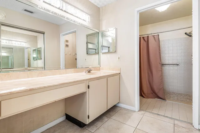a bathroom with a shower and a toilet