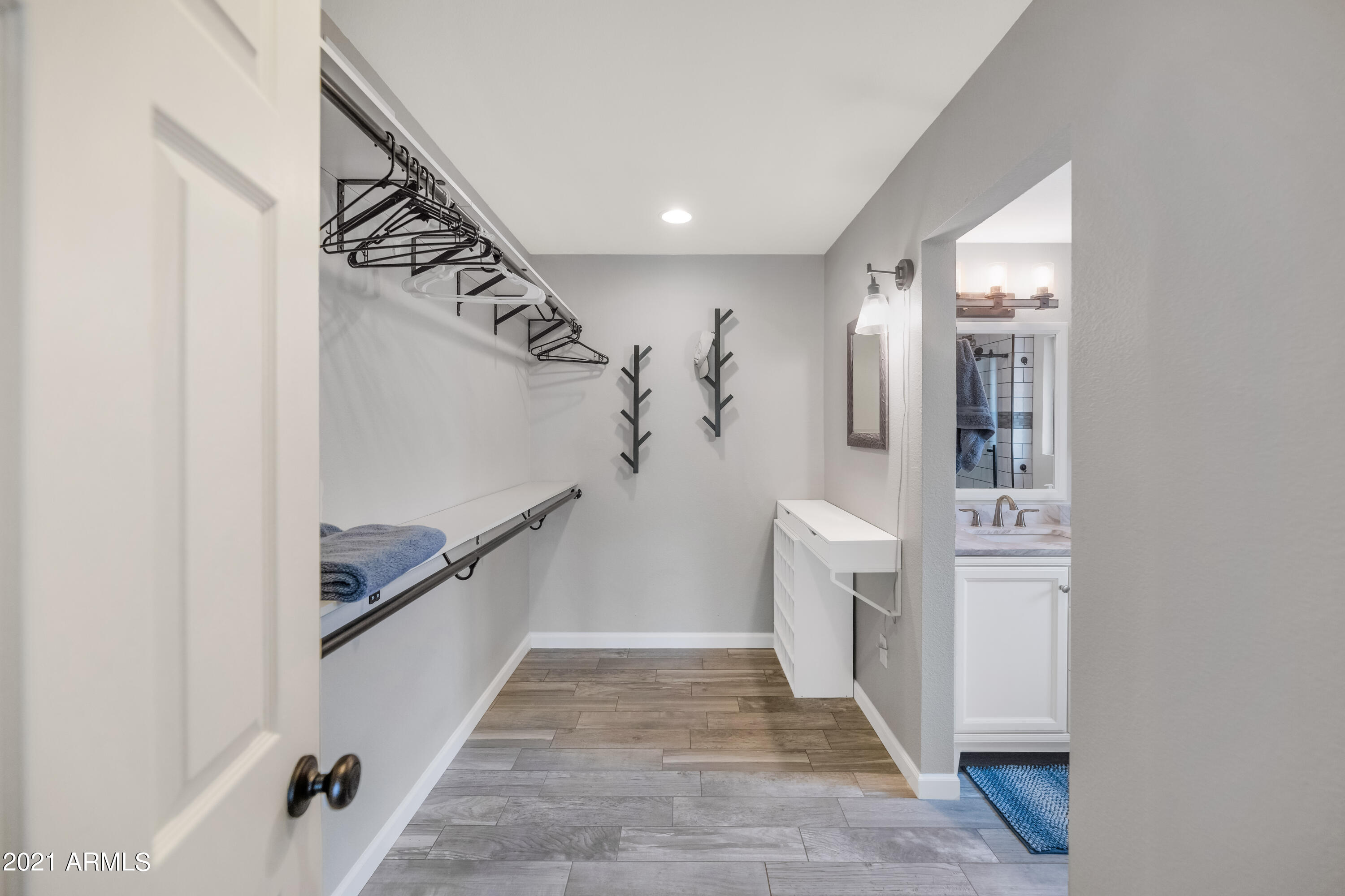 19034 North Palo Verde Drive Sun City, AZ 85373 - Photo 21 of 35 PRIMARY BEDROOM CLOSET AREA