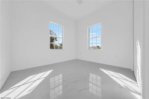 an empty room with windows