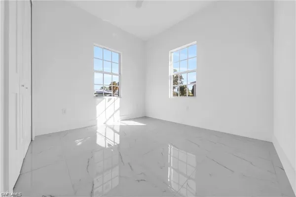 a view of empty room with windows