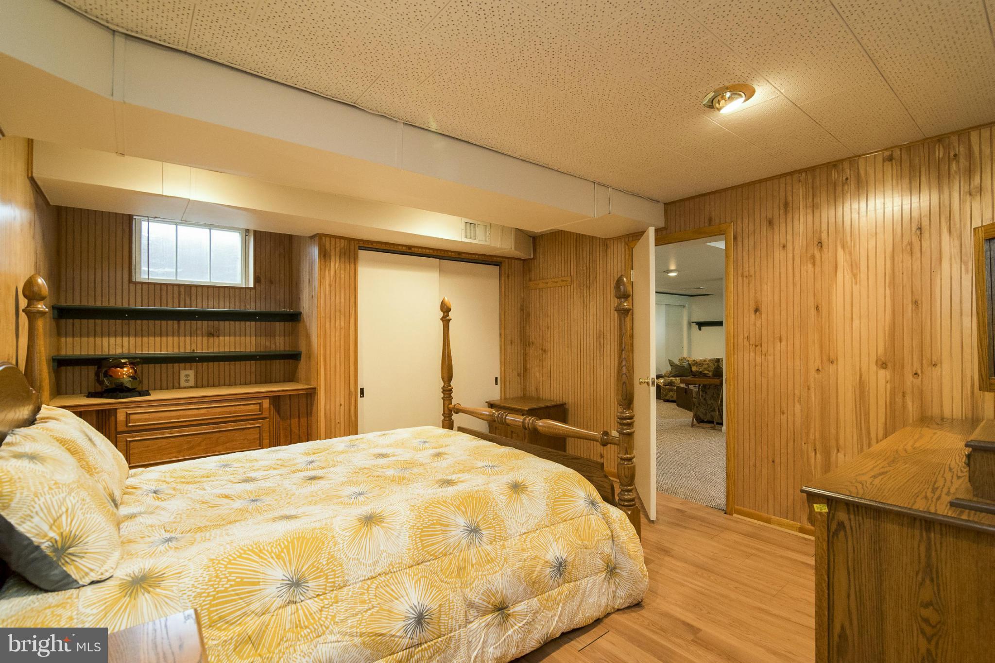 1200 Doves Cove Road Baltimore, MD 21286 - Photo 20 of 25 a bedroom with a bed and a flat tv screen on dresser