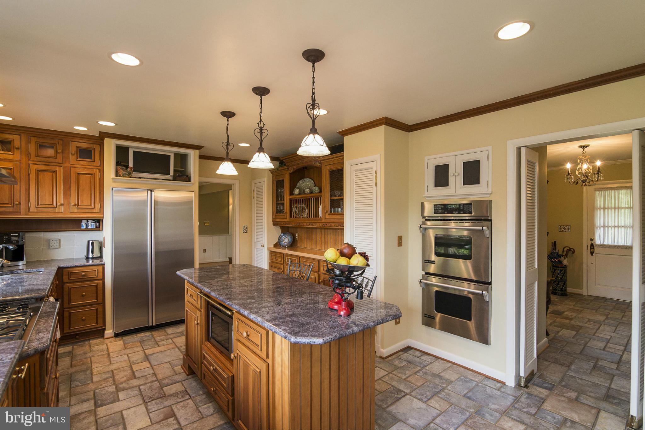 1200 Doves Cove Road Baltimore, MD 21286 - Photo 5 of 25 a kitchen that has a lot of cabinets and refrigerator