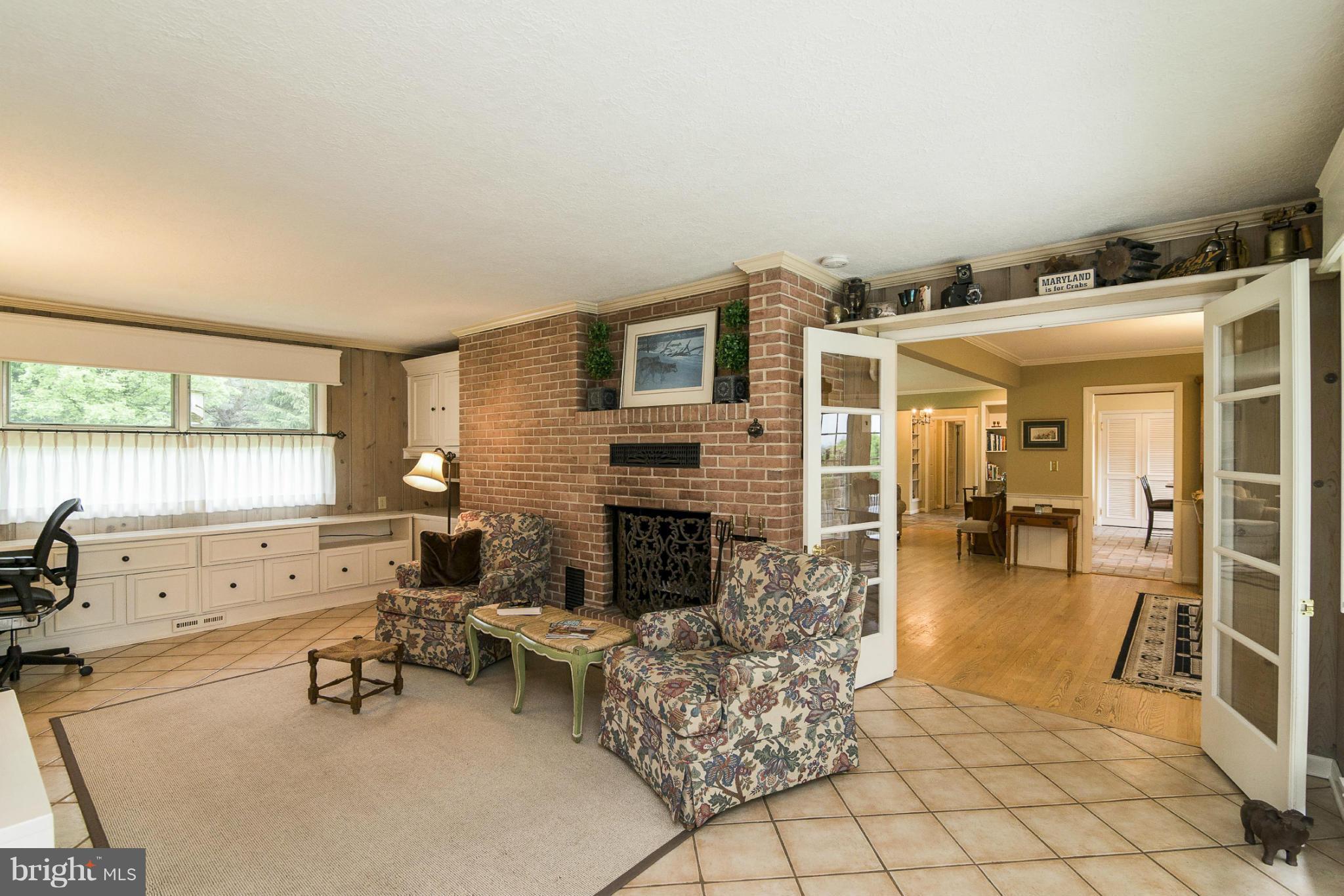 1200 Doves Cove Road Baltimore, MD 21286 - Photo 8 of 25 a living room with furniture and a fireplace
