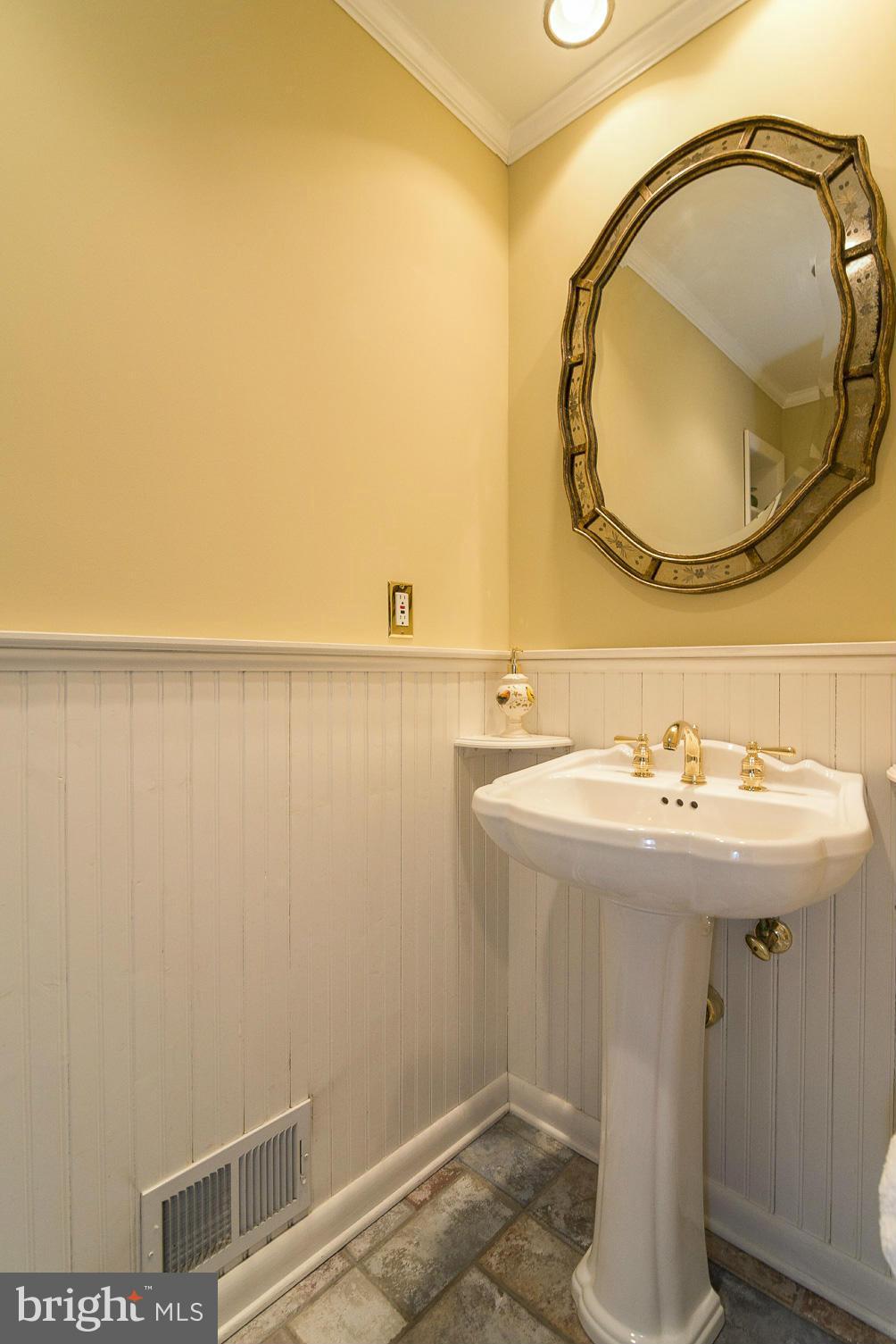 1200 Doves Cove Road Baltimore, MD 21286 - Photo 10 of 25 a bathroom with a sink and a mirror