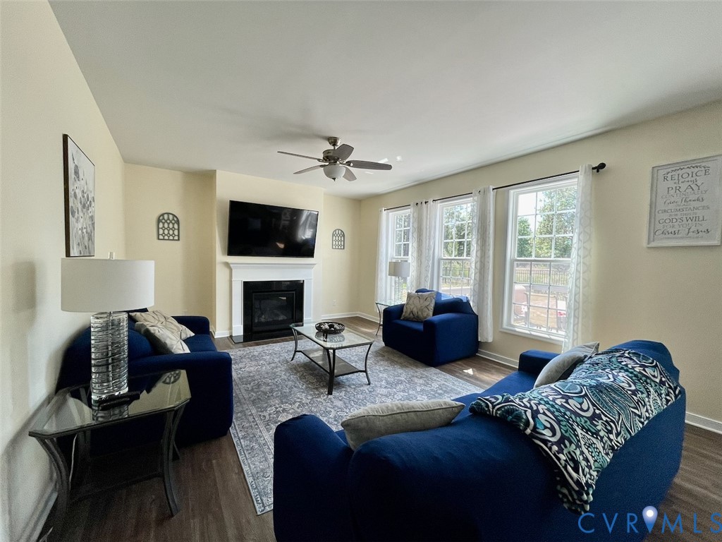 9506 Simonsville Road Midlothian, VA 23112 - Photo 6 of 27 a bedroom with a bed a couch and dresser next to a window