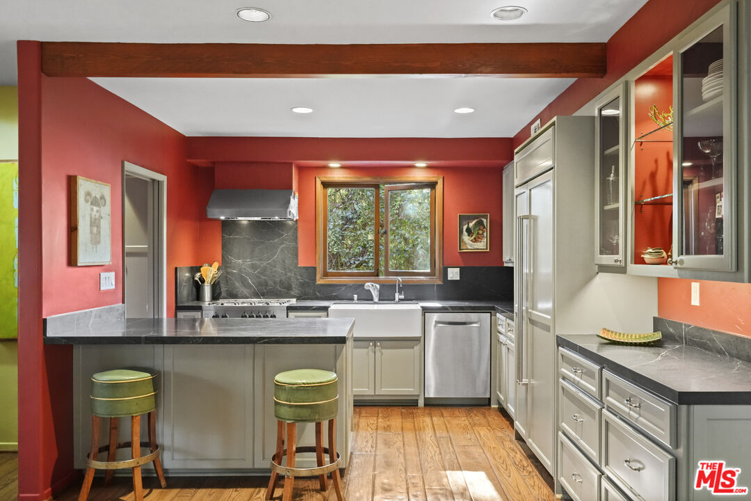 809 Basin Drive Topanga, CA 90290 - Photo 12 of 57 a kitchen with a sink stove and cabinets