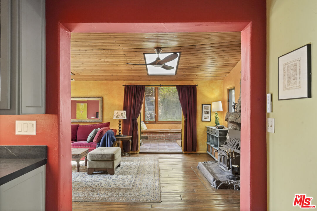 809 Basin Drive Topanga, CA 90290 - Photo 15 of 57 a living room with furniture and large windows