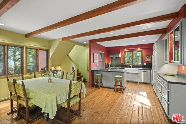 a wooden bench sitting in front of a building