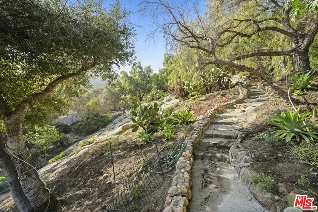 a view of a patio with couches chairs and a table and chairs