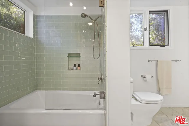 a bathroom with a sink double vanity and a mirror
