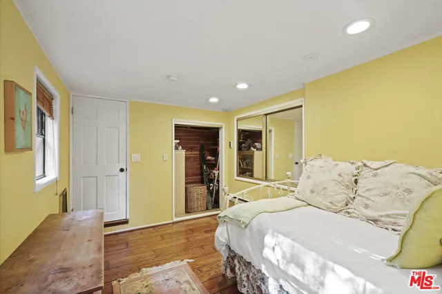 a bed room with a bed and a window