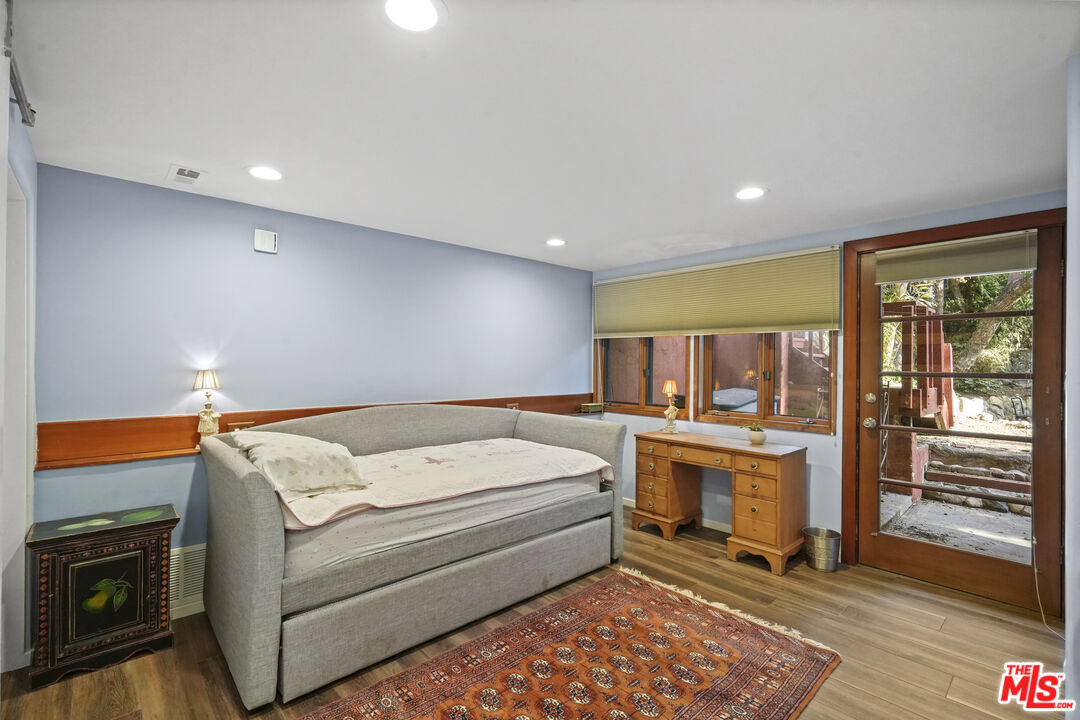 809 Basin Drive Topanga, CA 90290 - Photo 45 of 57 a bed room with a bed and a fireplace