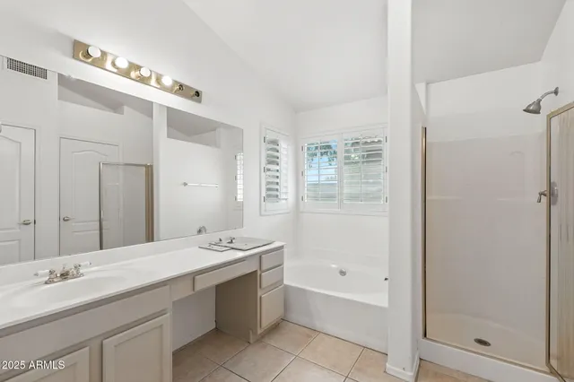 a view of an empty room with a ceiling fan