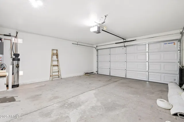 an empty room with a ceiling fan