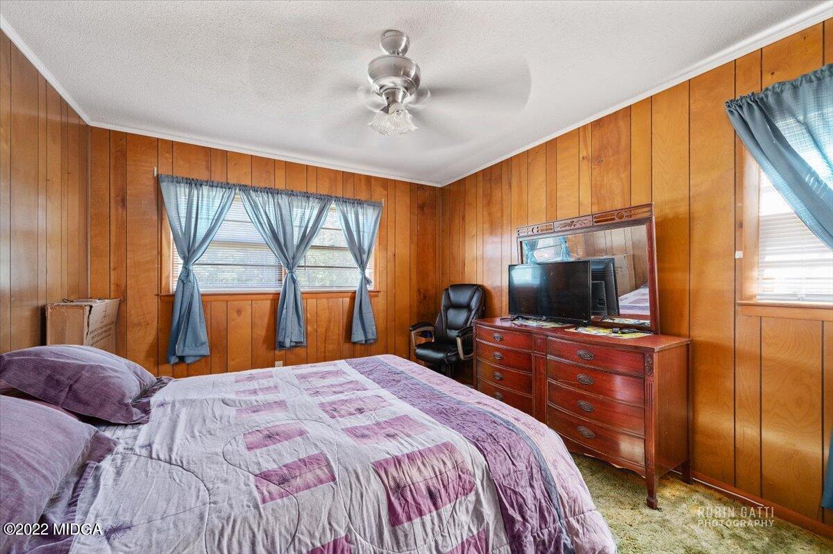 1979 Bonner Gilbert Road Macon, GA 31220 - Photo 16 of 35 a bedroom with a bed and a flat tv screen on dresser