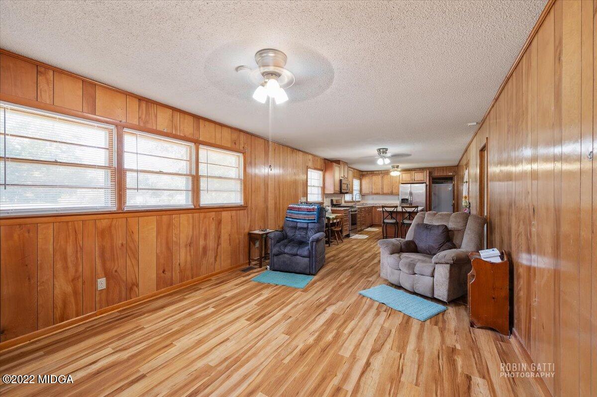 1979 Bonner Gilbert Road Macon, GA 31220 - Photo 4 of 35 a living room with couches and kitchen view with wooden floor