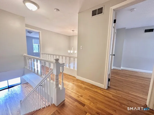 a view of entryway with wooden floor
