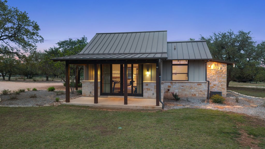 2560 Bell Springs Road Dripping Springs, TX 78620 - Photo 33 of 40 a view of a house with backyard and porch