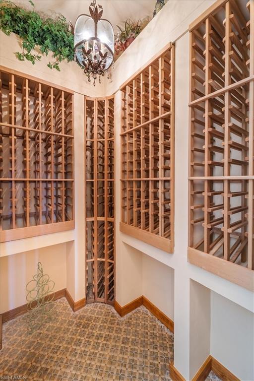 15299 Corsini Lane Naples, FL 34110 - Photo 13 of 40 a view of front door with wooden floor and seating space