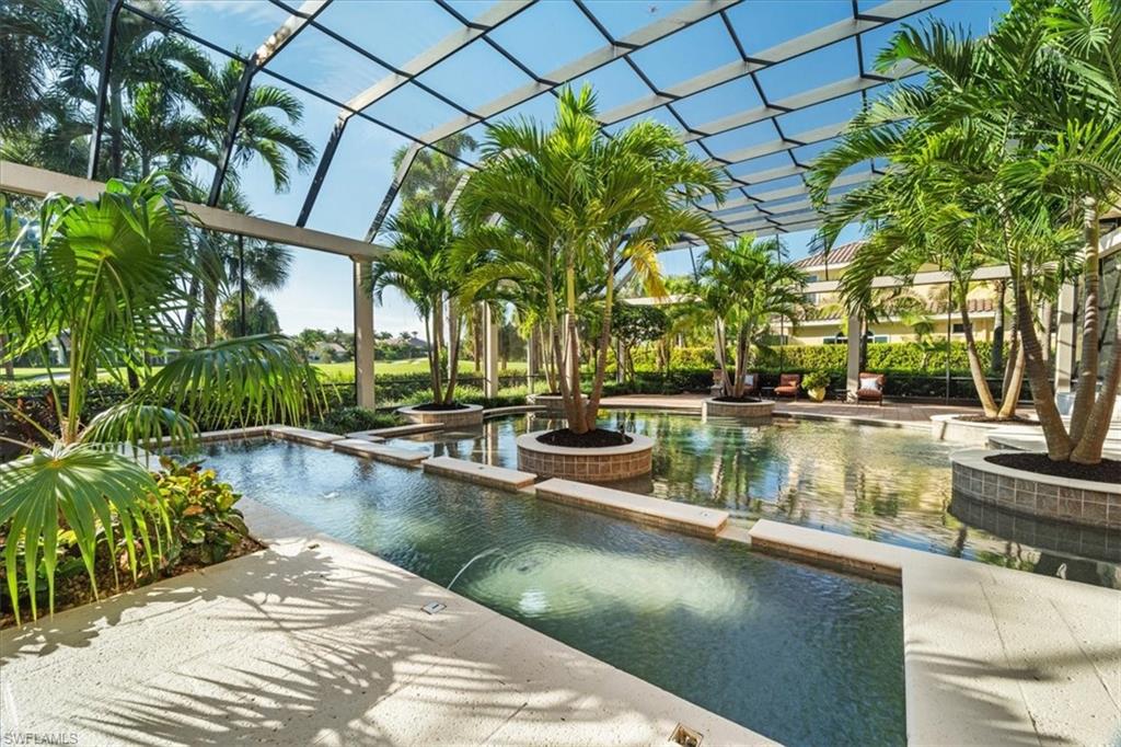 15299 Corsini Lane Naples, FL 34110 - Photo 25 of 40 a view of a lake with a house