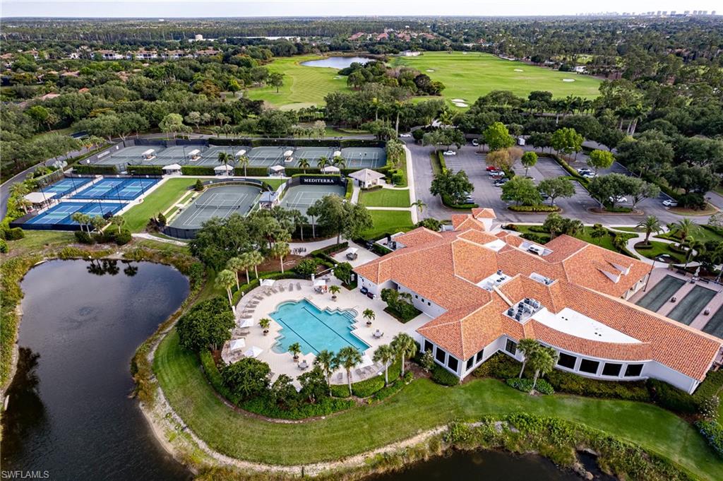 15299 Corsini Lane Naples, FL 34110 - Photo 39 of 40 an aerial view of residential houses with outdoor space and lake view