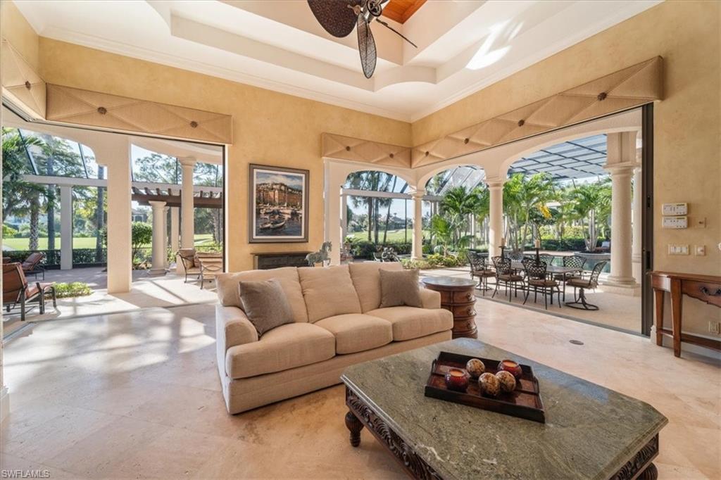 15299 Corsini Lane Naples, FL 34110 - Photo 9 of 40 a living room with furniture and a large window
