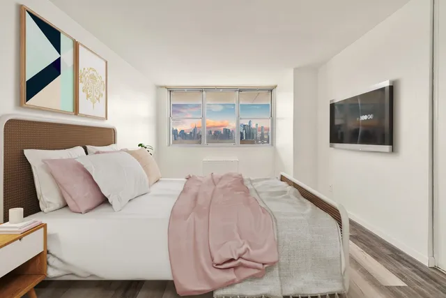 a bathroom with a sink toilet a mirror and bathtub