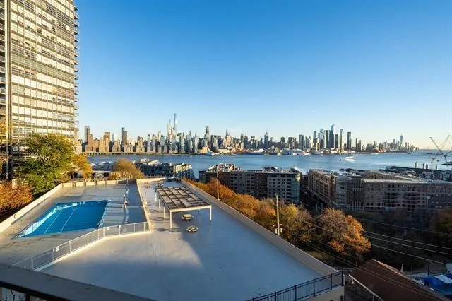 a view of swimming pool with a sitting area