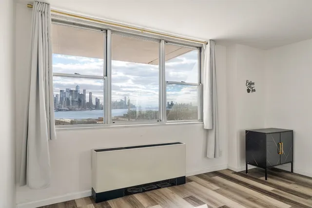 a view of room with window and a hallway