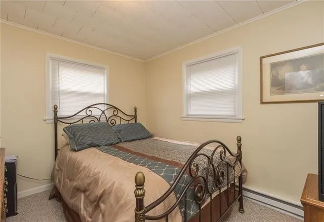 a bedroom with a bed and a table in it