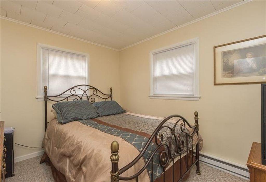 2902 20th St Extension, Unit 1 Beaver Falls, PA 15010 - Photo 5 of 7 a bedroom with a bed and a table in it