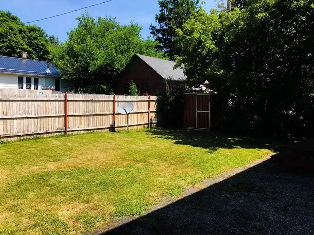 a view of house with swimming pool