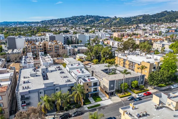 an aerial view of residential houses with outdoor space