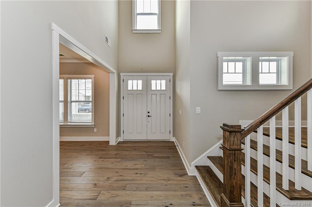 3072 Fish Story Court, Unit 360 Fort Mill, SC 29708 - Photo 5 of 27 a view of an entryway with wooden floor and stairs