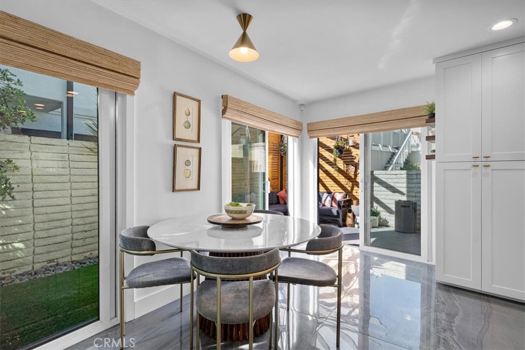 35 Geneva Walk Long Beach, CA 90803 - Photo 11 of 52 a view of a dining room with furniture and wooden floor