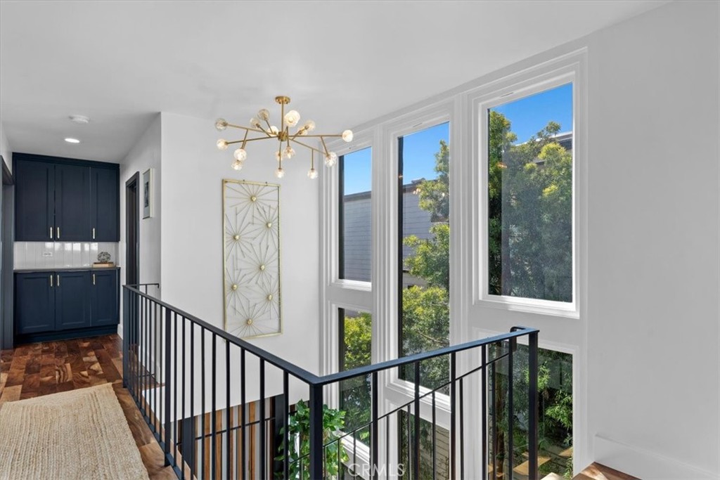 35 Geneva Walk Long Beach, CA 90803 - Photo 25 of 52 a view of a hallway with wooden floor and entryway