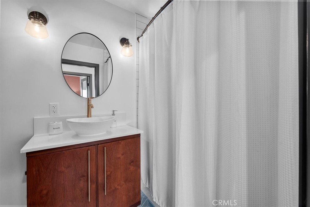 35 Geneva Walk Long Beach, CA 90803 - Photo 30 of 52 a bathroom with a sink and a mirror