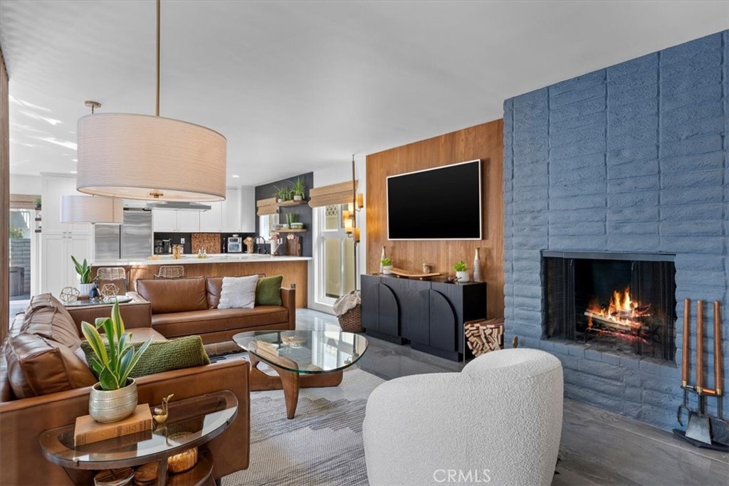 35 Geneva Walk Long Beach, CA 90803 - Photo 3 of 52 a living room with furniture a flat screen tv and a fireplace