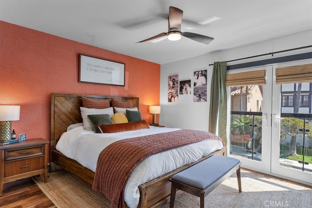 35 Geneva Walk Long Beach, CA 90803 - Photo 35 of 52 a bedroom with bed and wooden floor