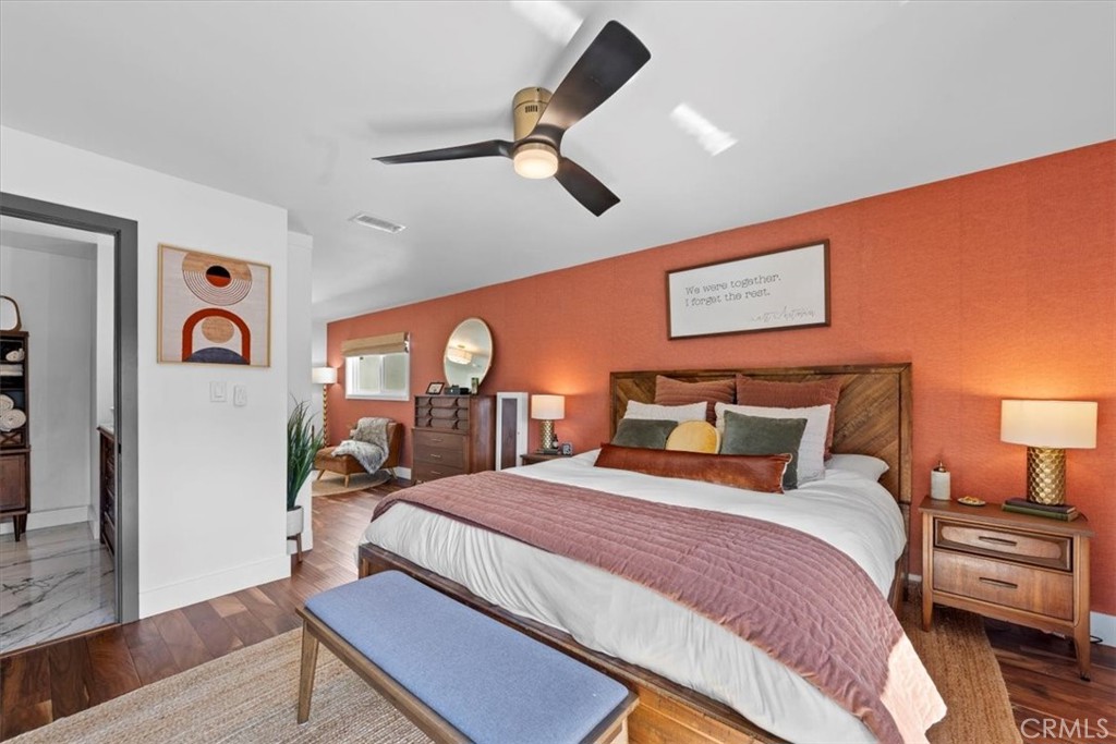 35 Geneva Walk Long Beach, CA 90803 - Photo 36 of 52 a bedroom with a bed and wooden floor