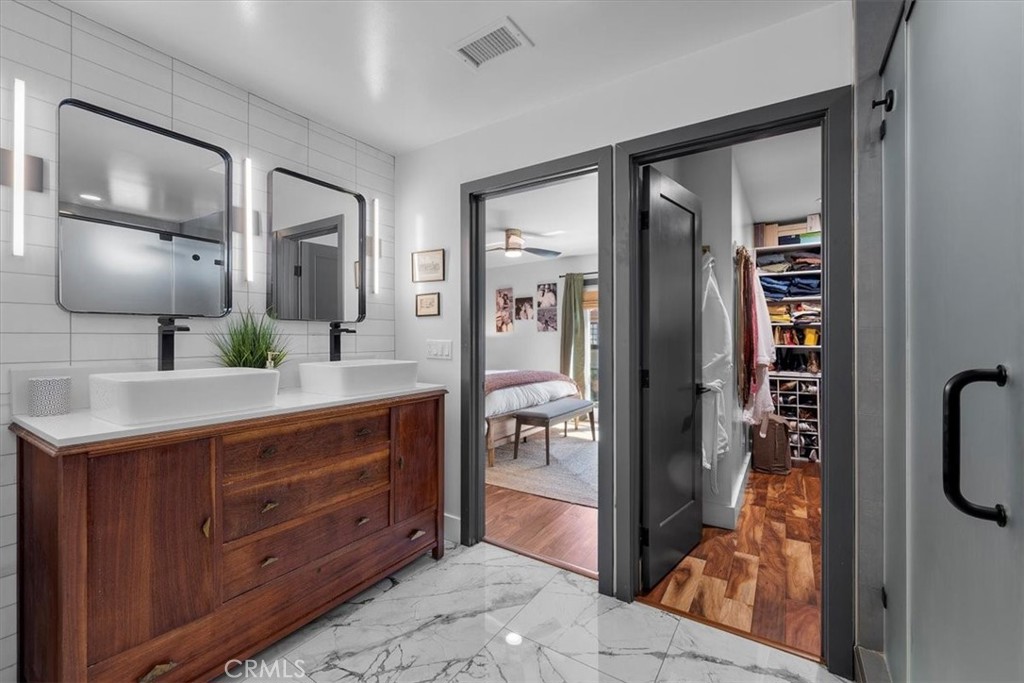 35 Geneva Walk Long Beach, CA 90803 - Photo 40 of 52 a en suite bathroom with a sink and mirror