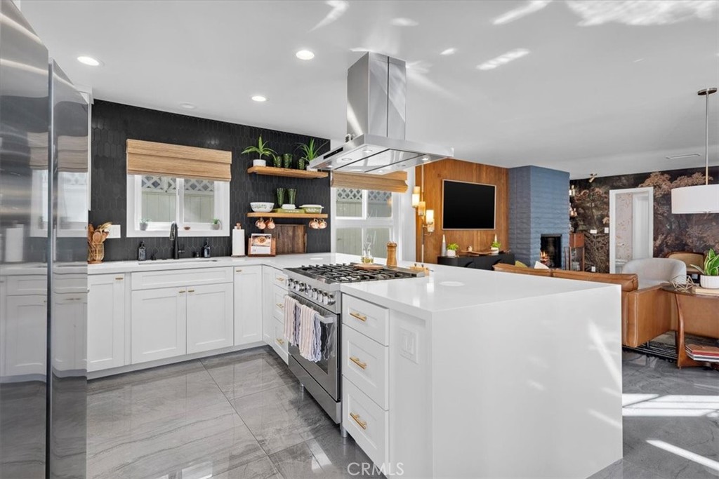 35 Geneva Walk Long Beach, CA 90803 - Photo 7 of 52 a kitchen with stainless steel appliances granite countertop a stove and a sink