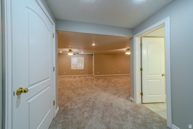 598 Hollow Creek Road Draper, UT 84020 - Photo 42 of 110 Carpeted room featuring an arched doorway, recessed lighting, and a window with plantation shutters