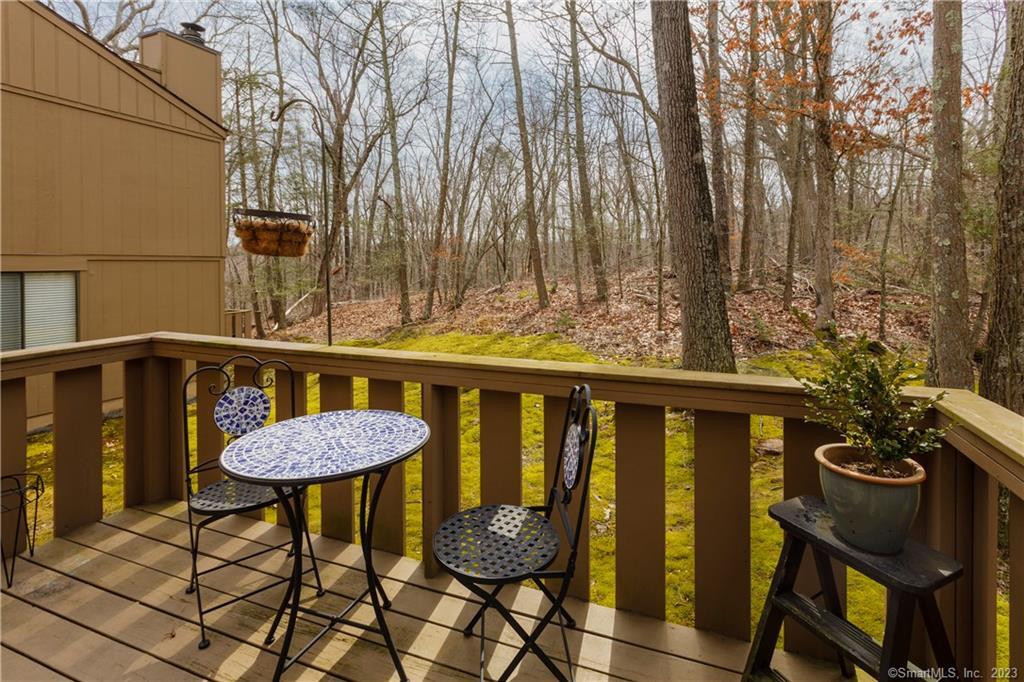 98 Granite Road Guilford, CT 06437 - Photo 1 of 1 a view of a chairs and table on the deck