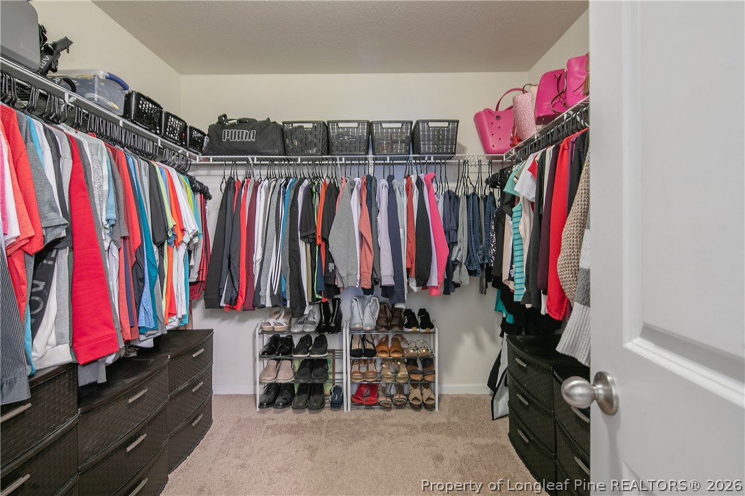 340 Battery Way Bunnlevel, NC 28323 - Photo 31 of 50 a view of walk in closet with clothes